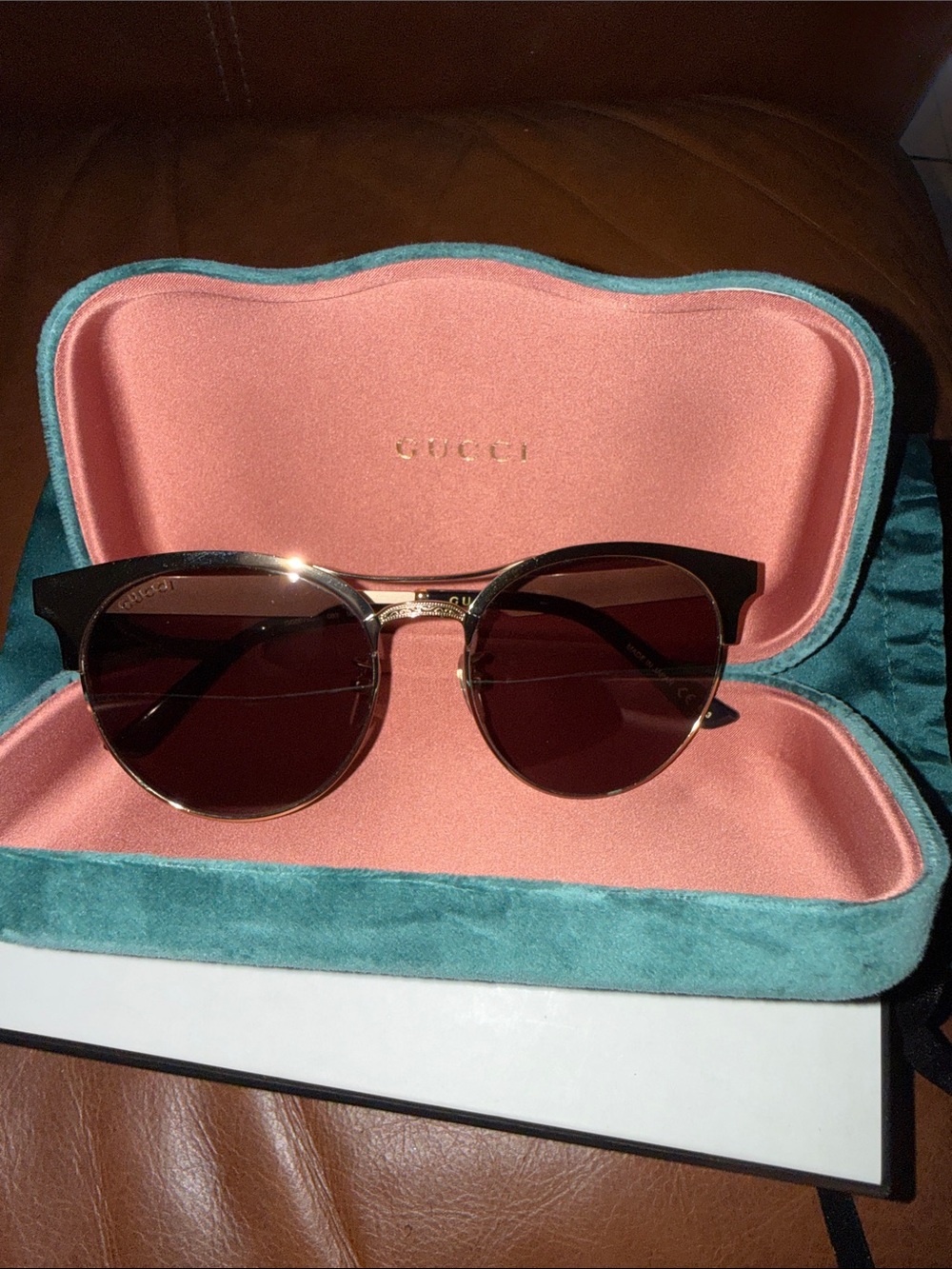 Gucci Black and Gold Round Sunglasses with Brown Lenses
